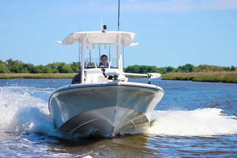 Slide: The Image of 2020 BlackJack 256 Bay boat cruising on a sunny day in a scenic waterway. - 4