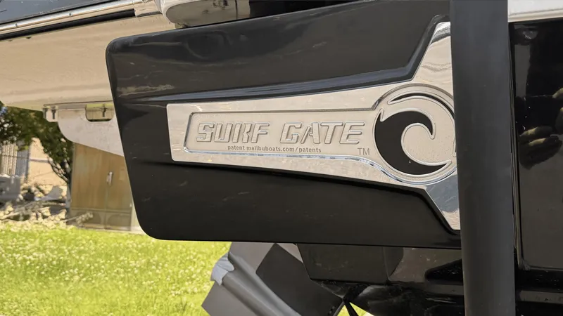 Slide: The Image of 2023 Chaparral 28 Surf boat with Surf Gate feature, enhancing wake surfing experience. - 5