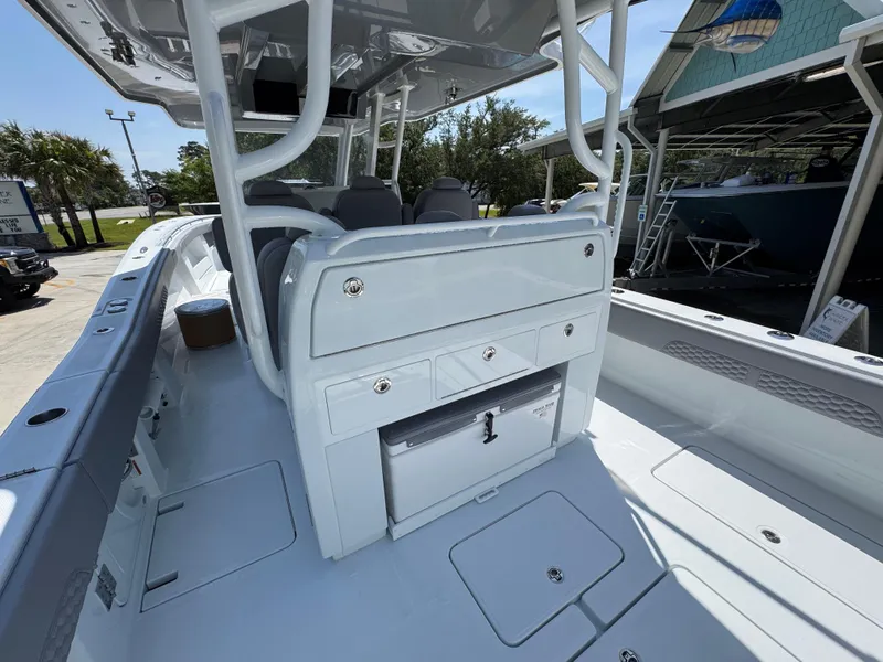 Slide: The Image of 2026 Invincible 43 Open Fisherman boat interior with storage compartments and seating. - 23