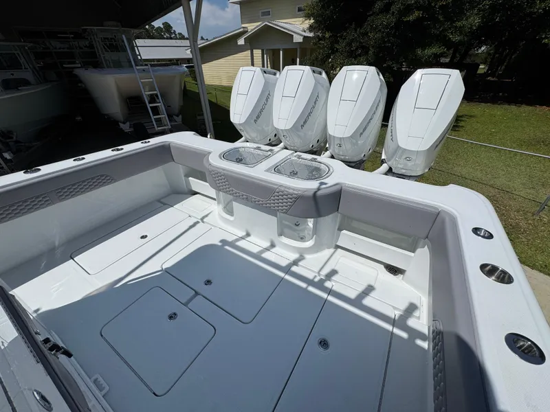 Slide: The Image of 2026 Invincible 43 Open Fisherman boat with four powerful outboard engines. - 25