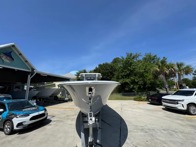 Slide: The Image of 2026 Invincible 43 Open Fisherman boat on trailer in sunny outdoor setting. - 6