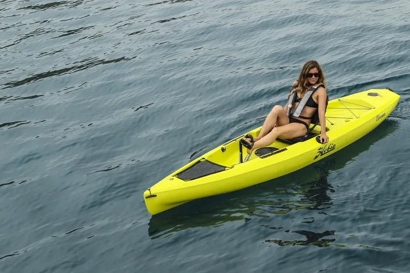Slide: The Image of Woman kayaking on a 2022 Hobie Compass in calm waters. - 4