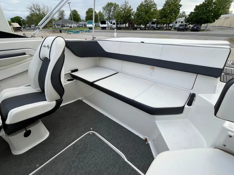 Slide: The Image of Interior of 2015 Sea Ray 19 SPX boat with white and black seating. - 11
