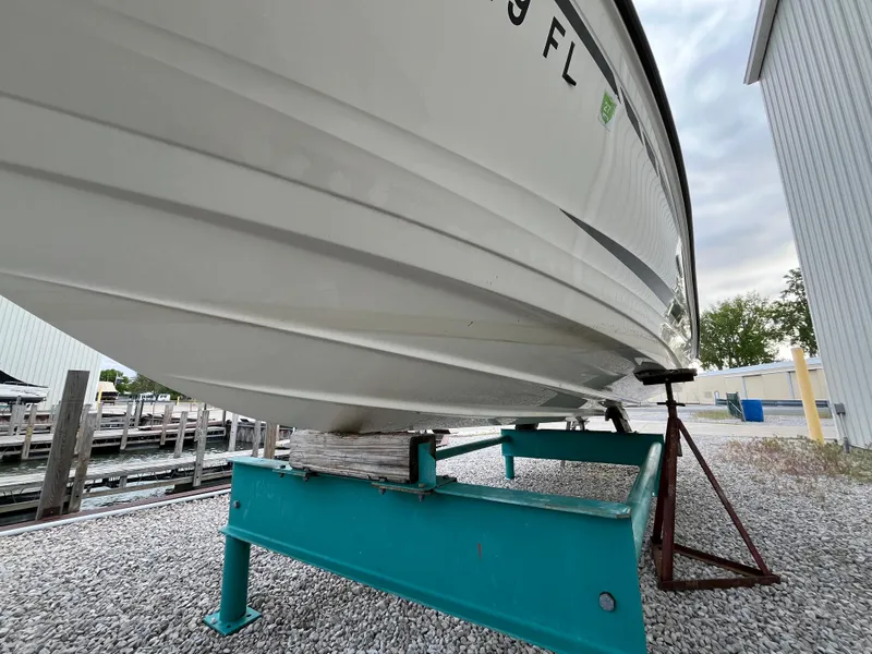 Slide: The Image of 2015 Sea Ray 19 SPX boat on a stand, dockside view. - 20