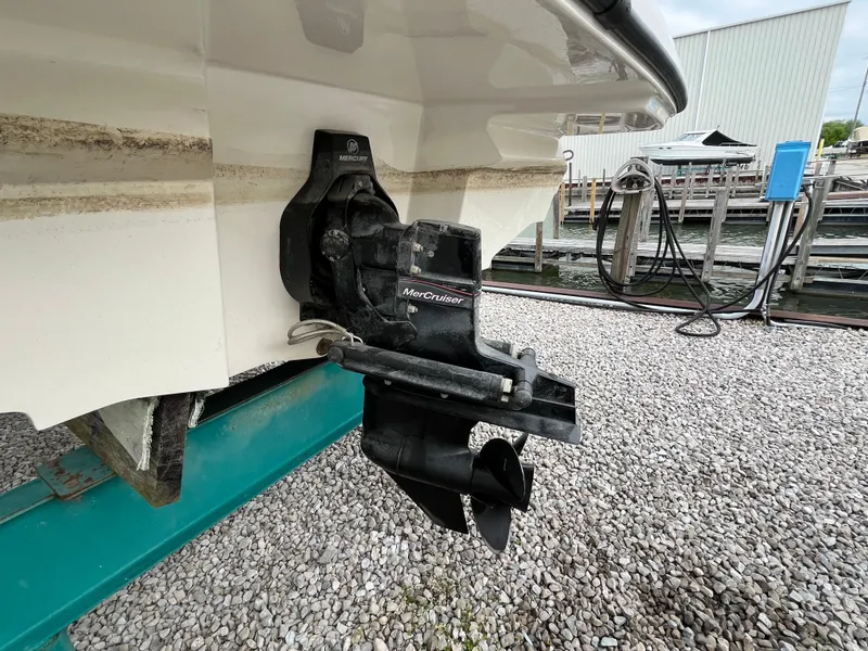 Slide: The Image of 2015 Sea Ray 19 SPX boat with MerCruiser outdrive, displayed on gravel. - 6