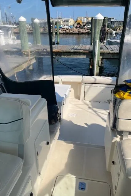 Slide: The Image of 2000 Pursuit 3000 Express boat interior at marina dock. - 5