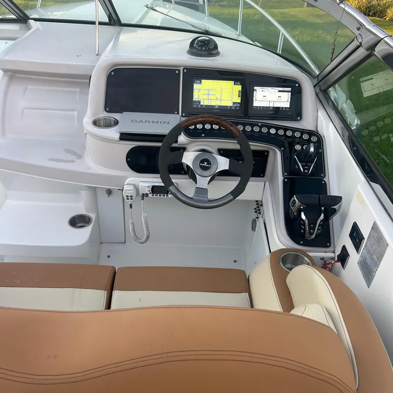 Slide: The Image of 2005 Formula 330 SS boat cockpit with Garmin navigation system and leather seating. - 18
