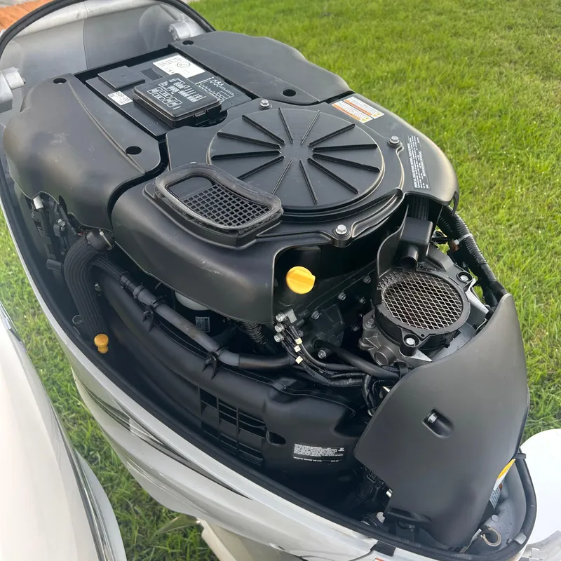 Slide: The Image of Engine of a 2005 Formula 330 SS boat, detailed view, on grass background. - 19