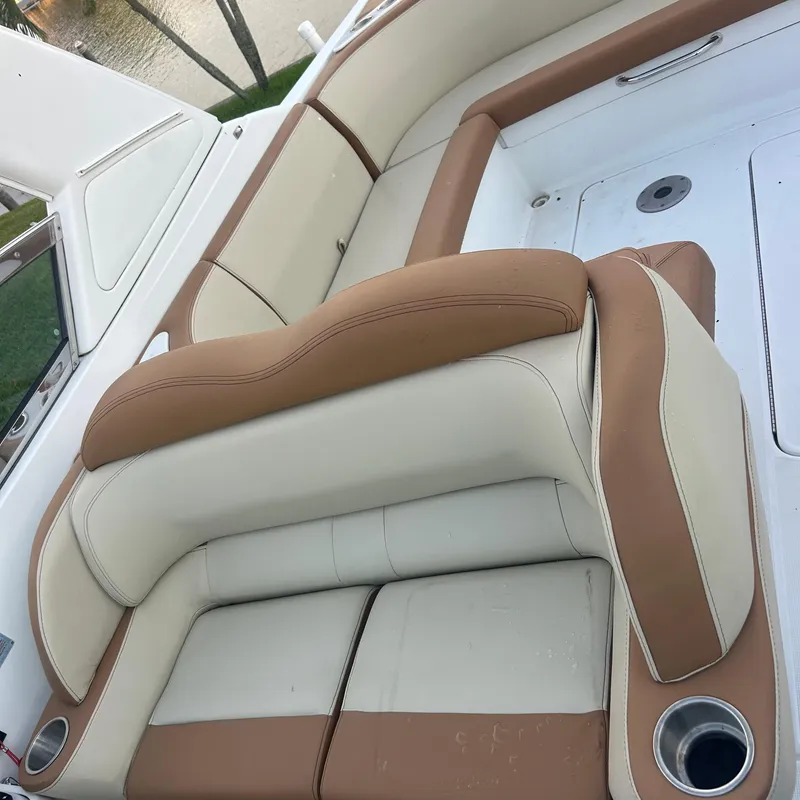 Slide: The Image of Luxury seating on a 2005 Formula 330 SS boat, featuring tan and cream upholstery. - 9