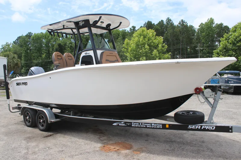 The Image of 2024 Sea Pro 242 Center Console boat on trailer, parked outdoors. - 0