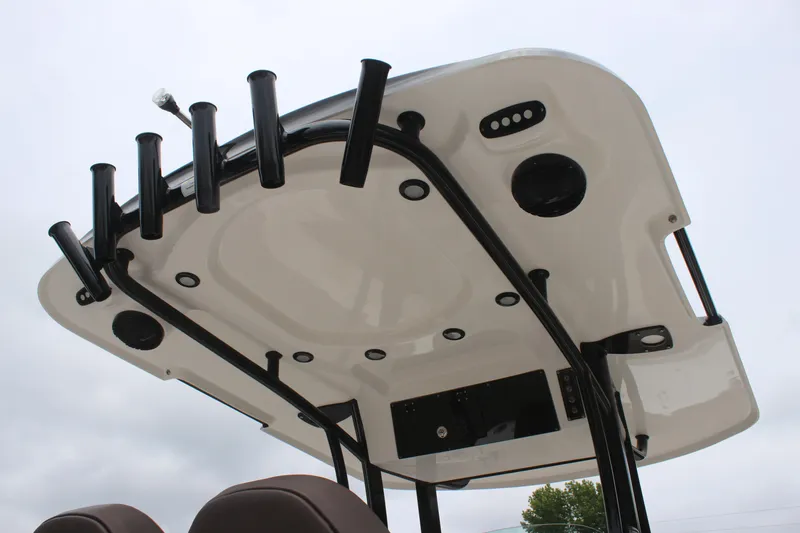 Slide: The Image of 2024 Sea Pro 242 Center Console boat's T-top with rod holders and speakers. - 10