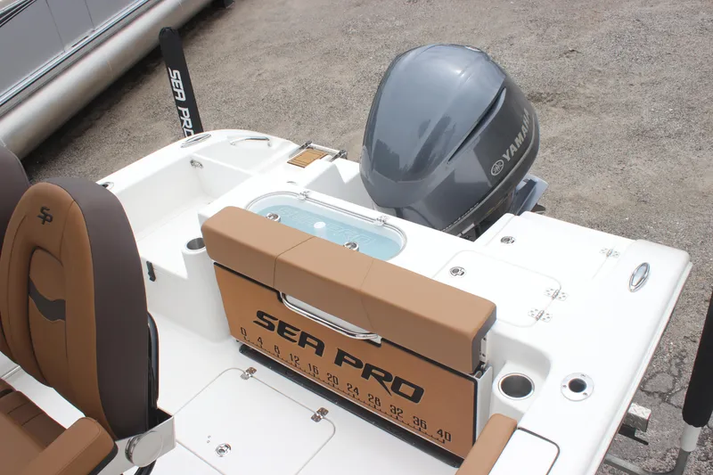 Slide: The Image of 2024 Sea Pro 242 Center Console boat with Yamaha engine, featuring seating and storage. - 12
