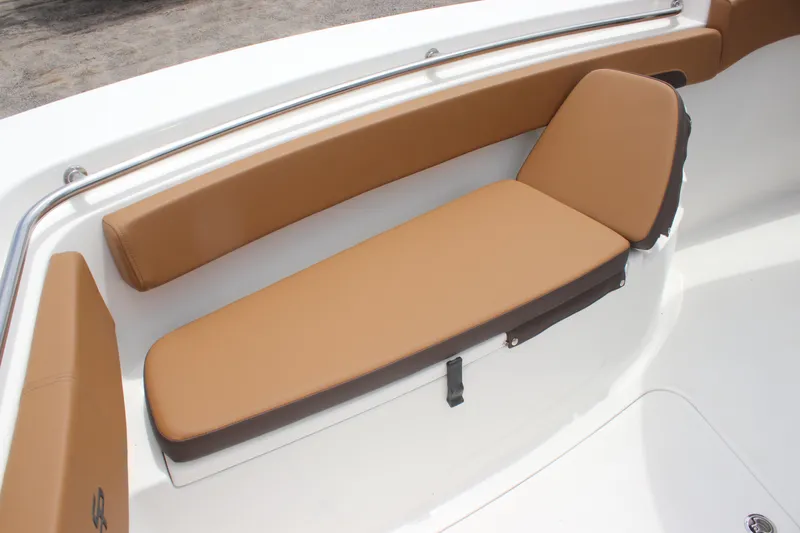 Slide: The Image of 2024 Sea Pro 242 Center Console boat with tan cushioned seating. - 16