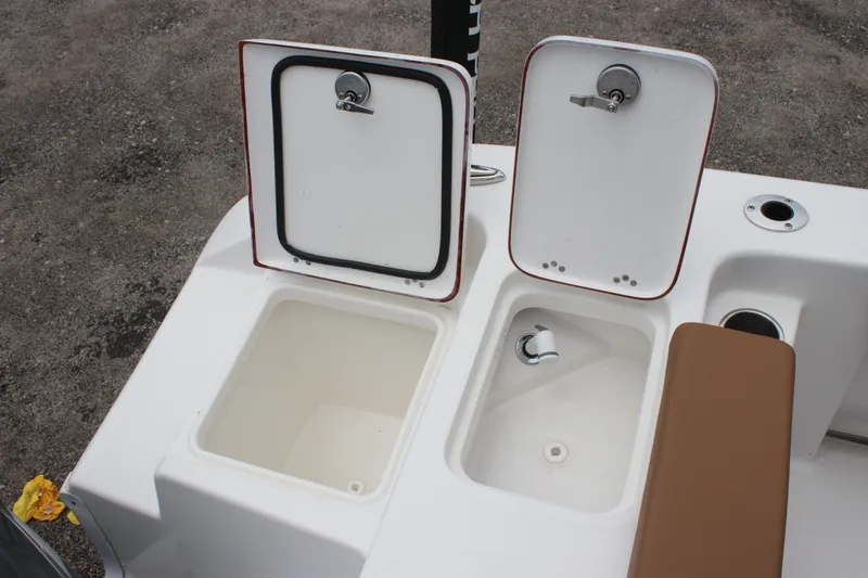 Slide: The Image of 2024 Sea Pro 242 Center Console boat storage compartments and seating area. - 26