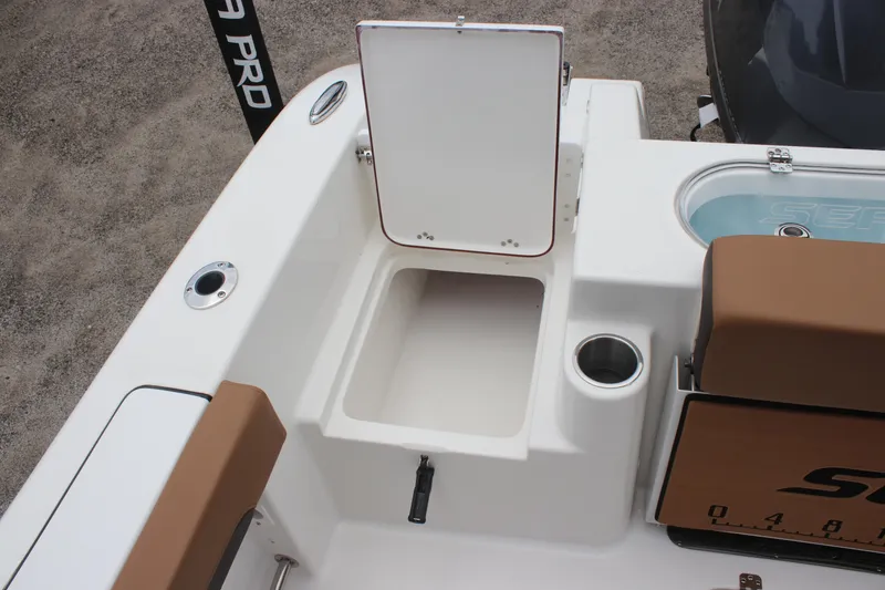 Slide: The Image of 2024 Sea Pro 242 Center Console boat interior with storage compartment and seating. - 27