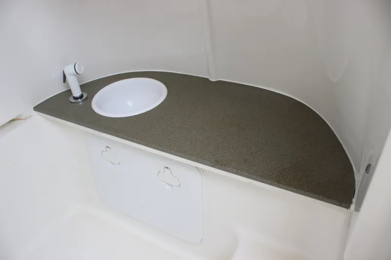 Slide: The Image of 2024 Sea Pro 242 Center Console interior sink and countertop detail. - 29