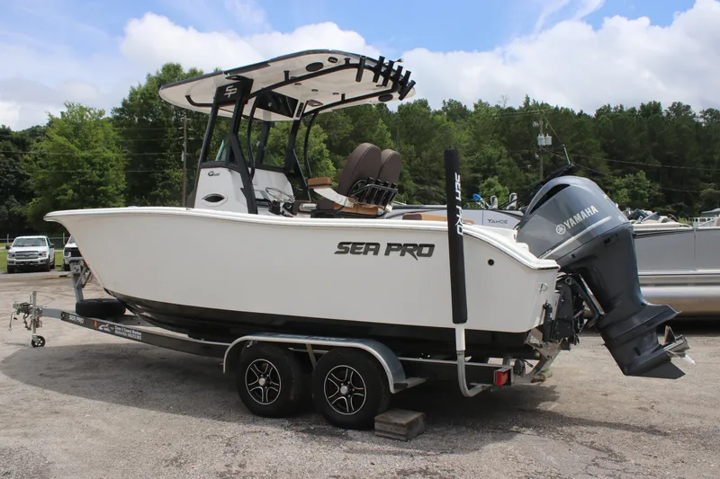 Slide: The Image of 2024 Sea Pro 242 Center Console boat on trailer, featuring Yamaha outboard motor. - 3