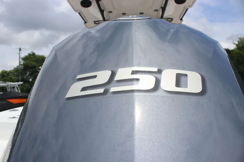 Slide: The Image of 2024 Sea Pro 242 Center Console boat with 250 horsepower engine, close-up view. - 32