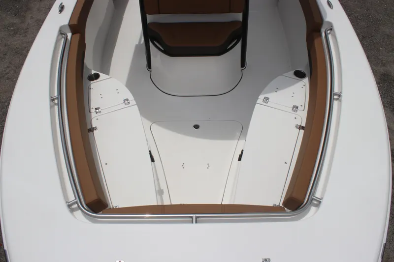 Slide: The Image of 2024 Sea Pro 242 Center Console boat interior with white and brown seating. - 33
