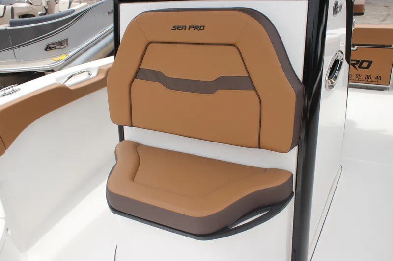 Slide: The Image of 2024 Sea Pro 242 Center Console boat seat, brown and tan upholstery. - 34