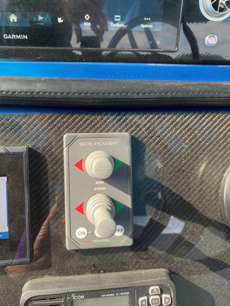 Slide: The Image of Control panel of 2023 Mystic Powerboats M3800 with Side-Power joystick and Garmin display. - 19