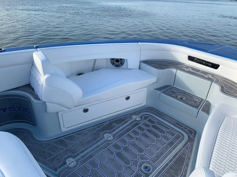 Slide: The Image of 2023 Mystic Powerboats M3800 interior with white seating and elegant flooring. - 4