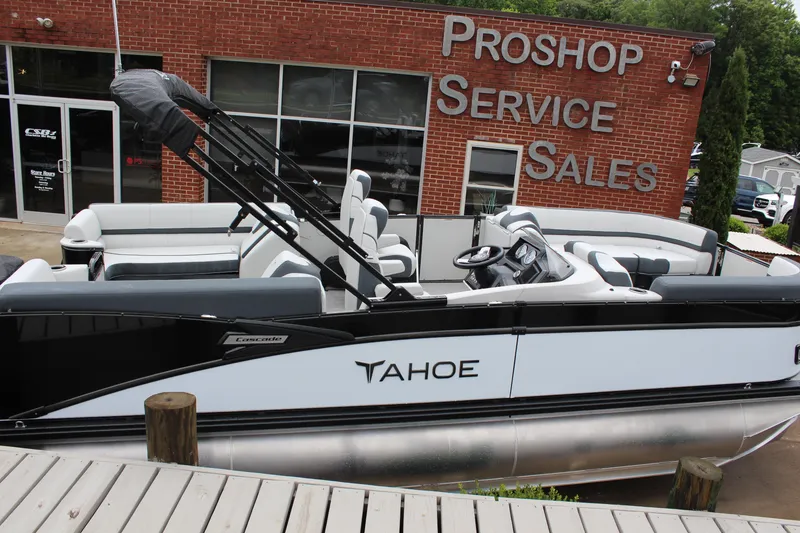 Slide: The Image of 2025 Tahoe Pontoon Cascade Quad Lounger at dealership, showcasing sleek design and modern features. - 5