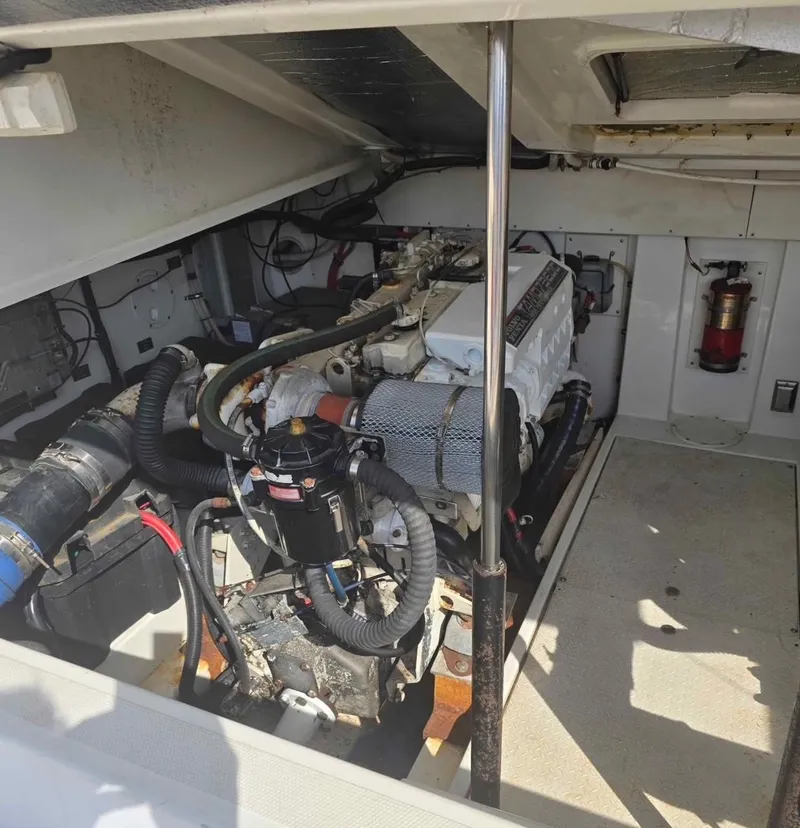 Slide: The Image of Engine room of a 2000 Rampage 38 Express boat, showcasing mechanical components. - 10