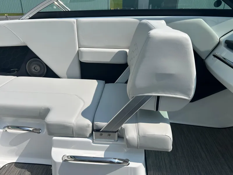 Slide: The Image of 2026 Four Winns H2 Freedom boat interior with white cushioned seating and sleek design. - 14