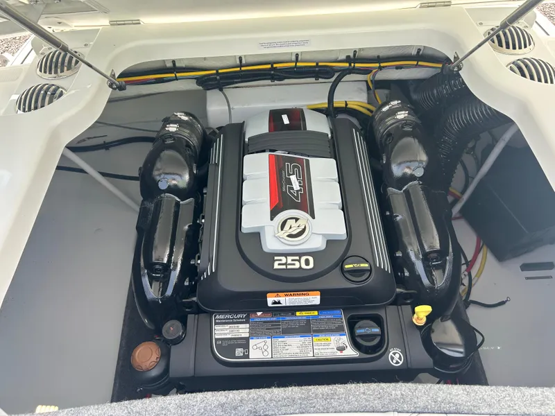 Slide: The Image of Engine compartment of 2026 Four Winns H2 Freedom boat, featuring a 250 horsepower engine. - 16