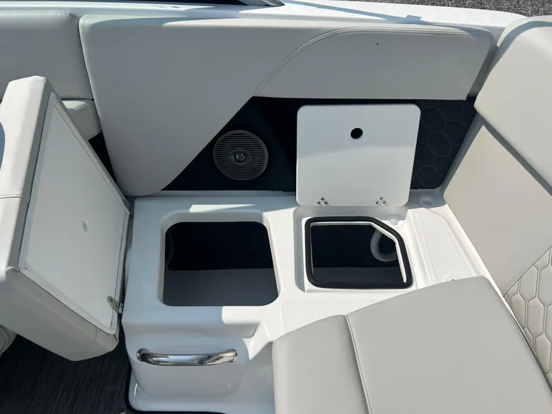 Slide: The Image of Interior seating and storage of 2026 Four Winns H2 Freedom boat. - 18