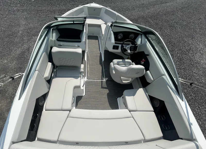 Slide: The Image of 2026 Four Winns H2 Freedom boat interior with sleek seating and modern dashboard. - 6