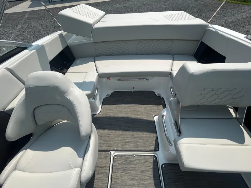 Slide: The Image of 2026 Four Winns H2 Freedom boat interior with white seating and modern design. - 8