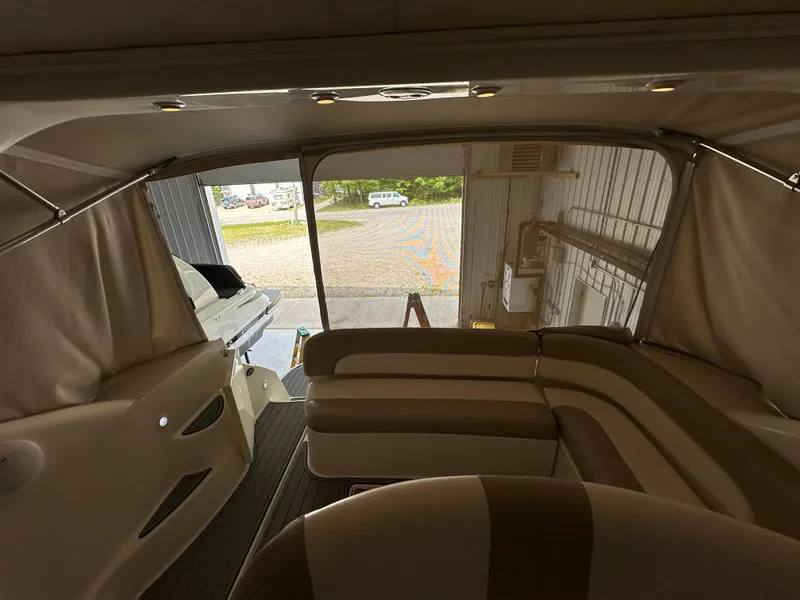 Slide: The Image of Interior view of 2004 Regal Commodore 3860 yacht with beige seating and covered deck. - 11
