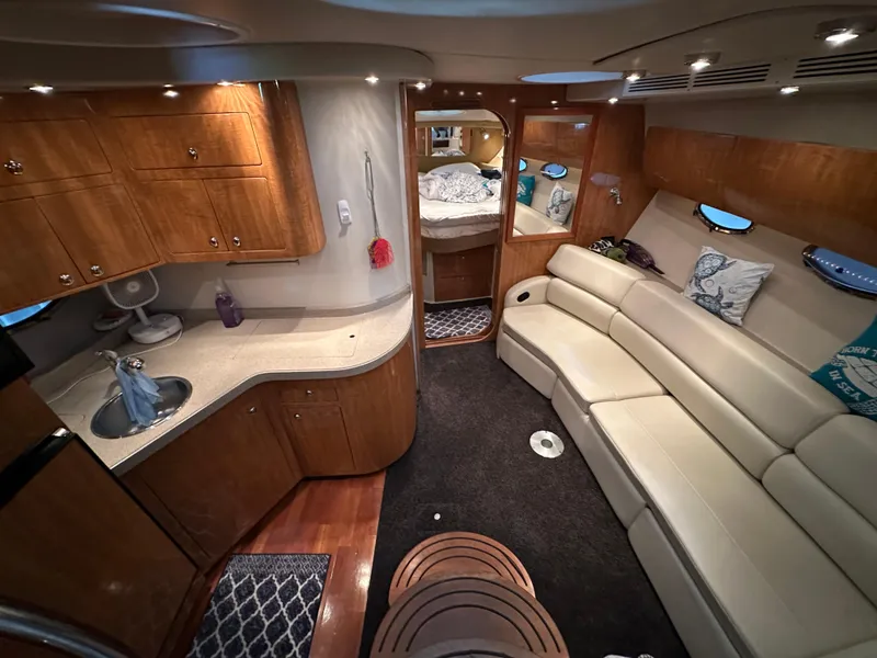 Slide: The Image of Luxurious interior of 2004 Regal Commodore 3860 yacht with kitchen and seating area. - 12