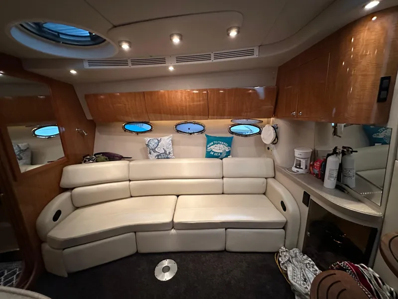 Slide: The Image of Luxurious interior of 2004 Regal Commodore 3860 yacht with plush seating and elegant wood finishes. - 13