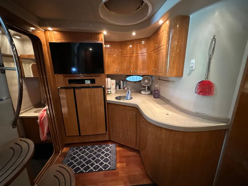 Slide: The Image of Luxurious 2004 Regal Commodore 3860 yacht interior with modern kitchen and entertainment area. - 15
