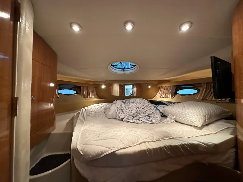 Slide: The Image of Luxurious cabin interior of 2004 Regal Commodore 3860 yacht with cozy bedding. - 17