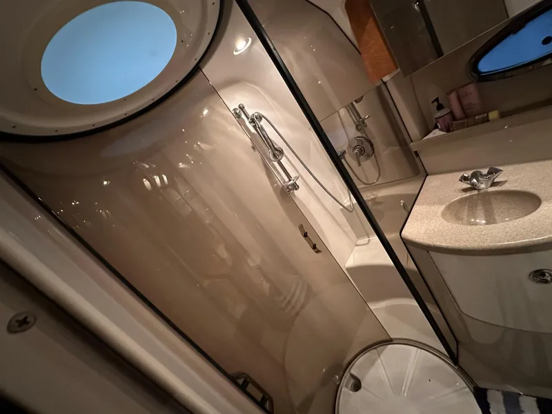 Slide: The Image of Luxurious bathroom in 2004 Regal Commodore 3860 yacht with shower and sink. - 21