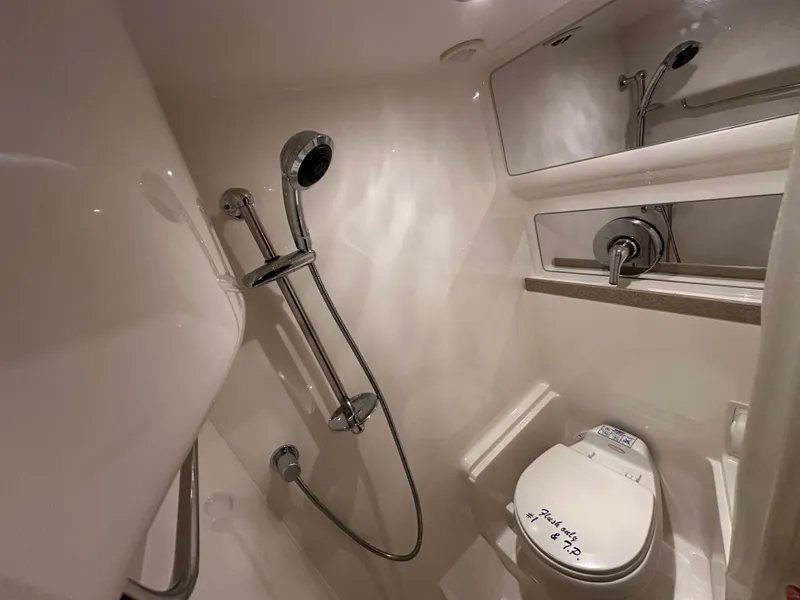 Slide: The Image of Bathroom interior of 2004 Regal Commodore 3860 yacht with shower and toilet. - 24
