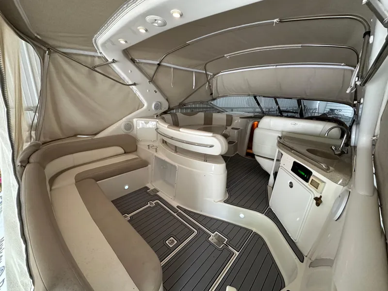 Slide: The Image of 2004 Regal Commodore 3860 interior with beige seating and modern amenities. - 3