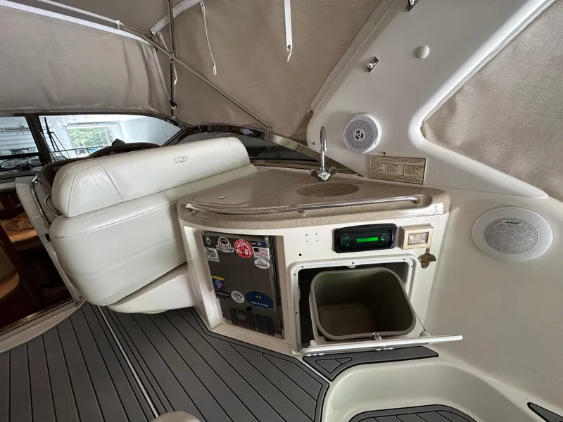 Slide: The Image of 2004 Regal Commodore 3860 yacht interior with seating, sink, and storage area. - 6