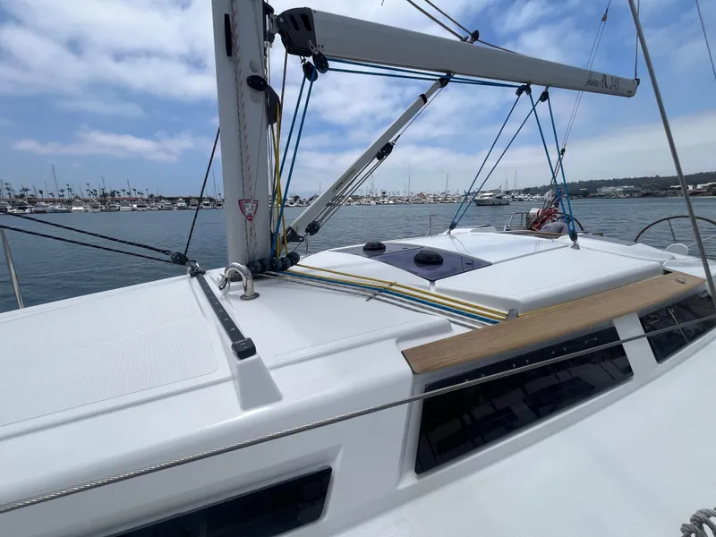 Slide: The Image of Sailing yacht Hanse 345, 2014 model, docked in a marina under a partly cloudy sky. - 33