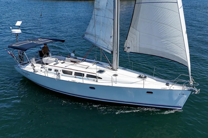 Slide: The Image of 2002 Jeanneau Sun Odyssey 43 sailing on calm blue waters. - 10