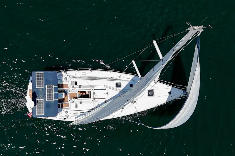 Slide: The Image of Aerial view of 2002 Jeanneau Sun Odyssey 43 sailing yacht on open water. - 15