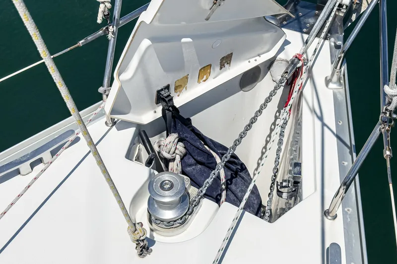 Slide: The Image of Anchor locker of 2002 Jeanneau Sun Odyssey 43 sailboat with ropes and winch. - 18