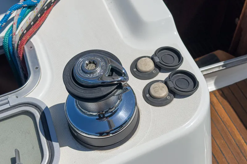 Slide: The Image of Winch and controls on 2002 Jeanneau Sun Odyssey 43 sailboat deck. - 22