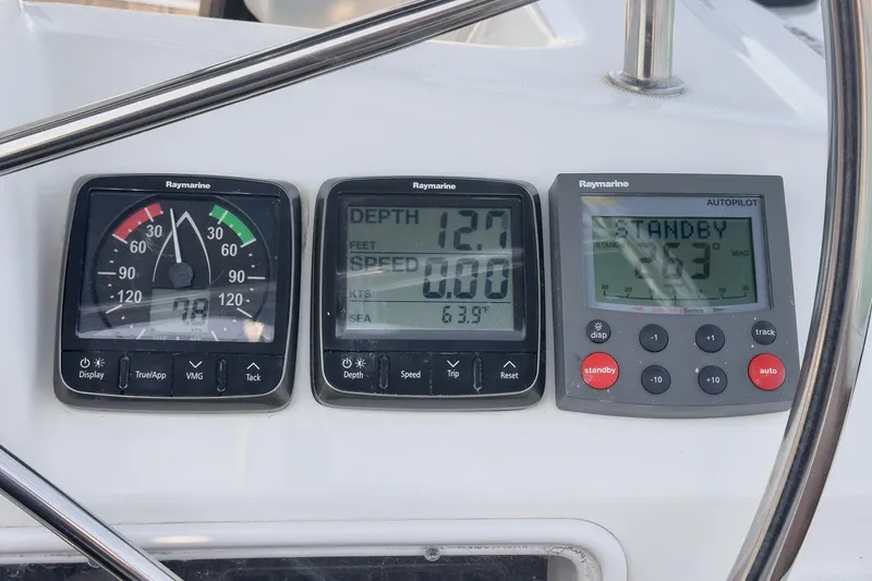 Slide: The Image of Instrument panel on a 2002 Jeanneau Sun Odyssey 43 sailboat, displaying depth, speed, and autopilot settings. - 28