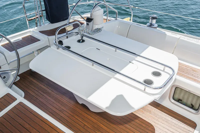 Slide: The Image of Cockpit of 2002 Jeanneau Sun Odyssey 43 sailboat with wooden deck and steering wheel. - 30