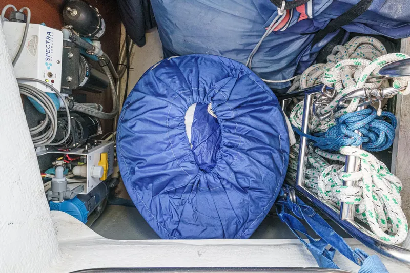 Slide: The Image of Storage compartment of 2002 Jeanneau Sun Odyssey 43 with ropes and equipment. - 34